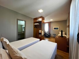 Standard (Triple Room) | Minibar, in-room safe, blackout drapes, soundproofing