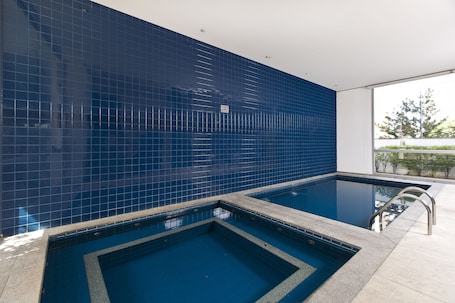 Indoor pool, open 6:00 AM to 10:00 PM, pool umbrellas, sun loungers