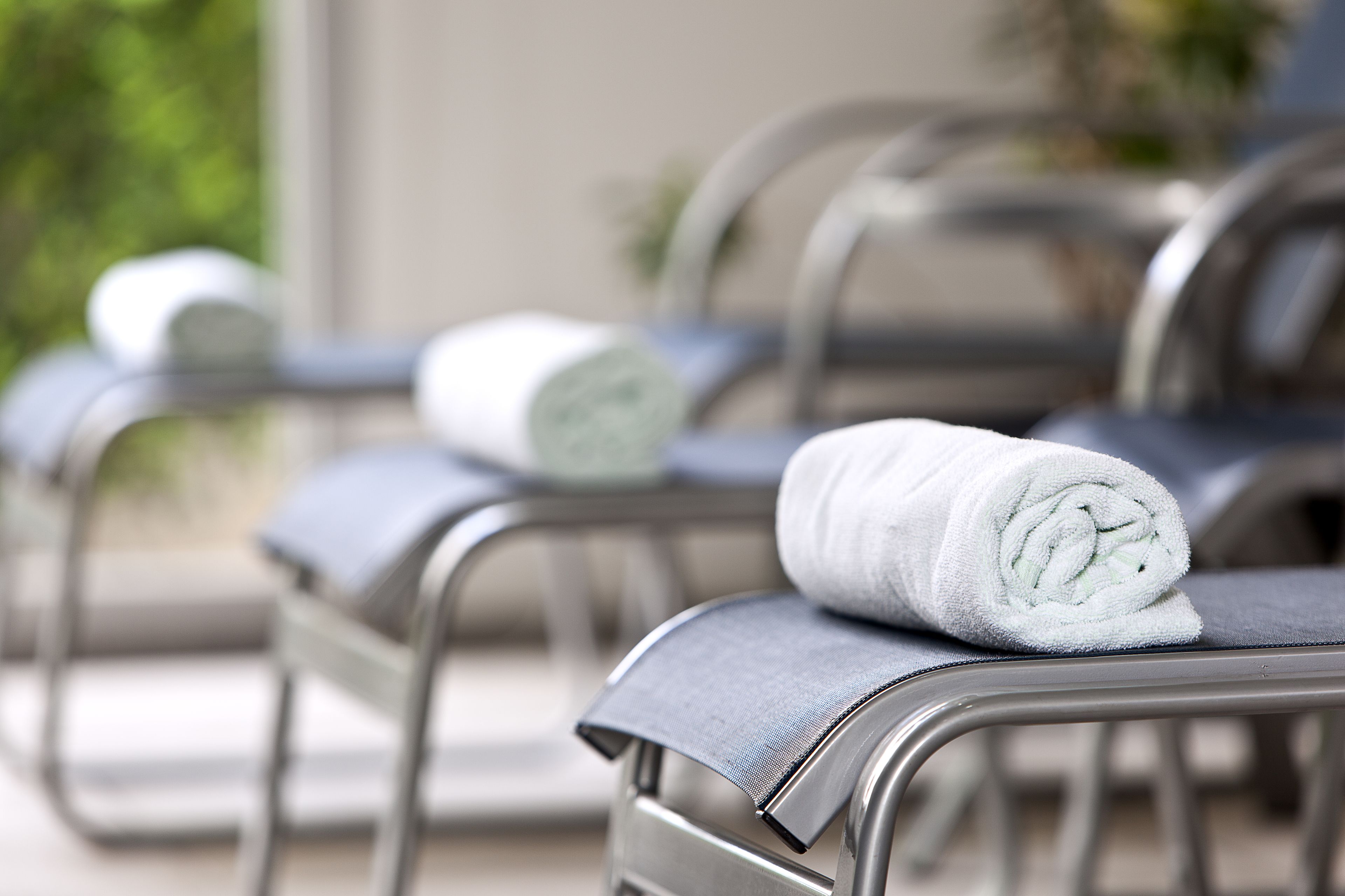 indoor pool, open 6:00 am to 10:00 pm, pool umbrellas, pool loungers