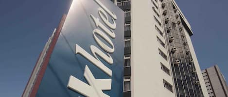 A tall hotel building with a prominent 'Parkhotel' sign in front.