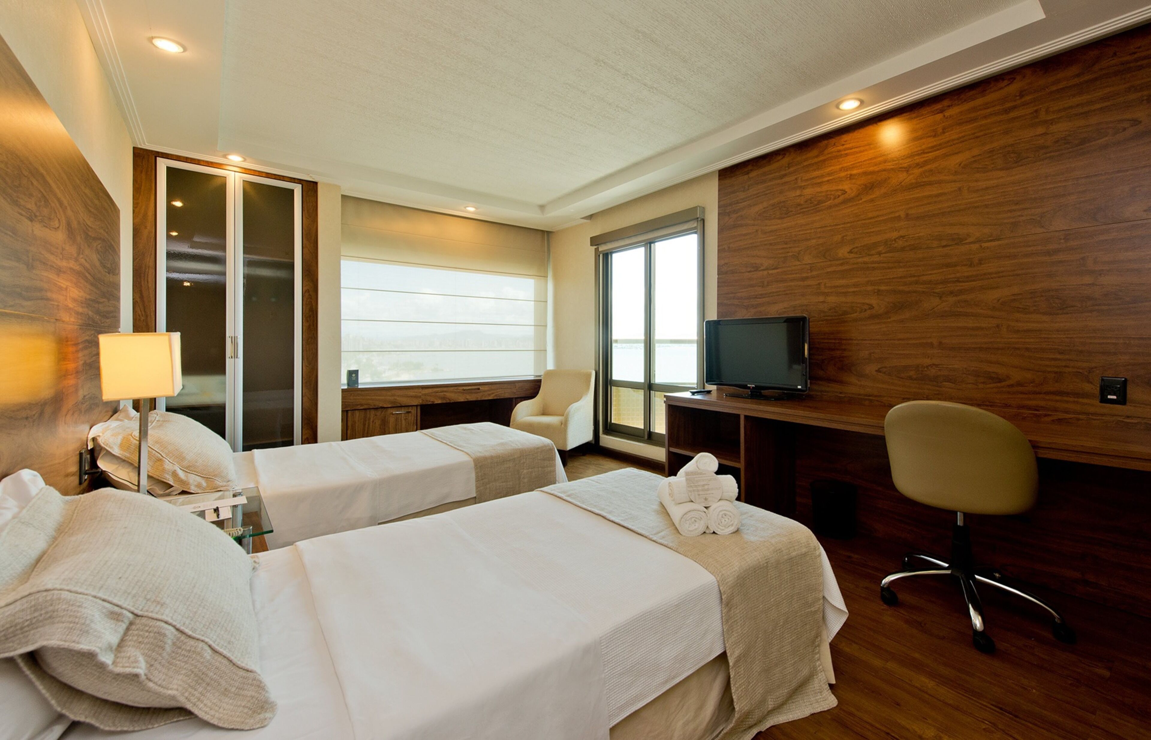 deluxe double room, balcony, ocean view | minibar, in-room safe, desk, blackout curtains