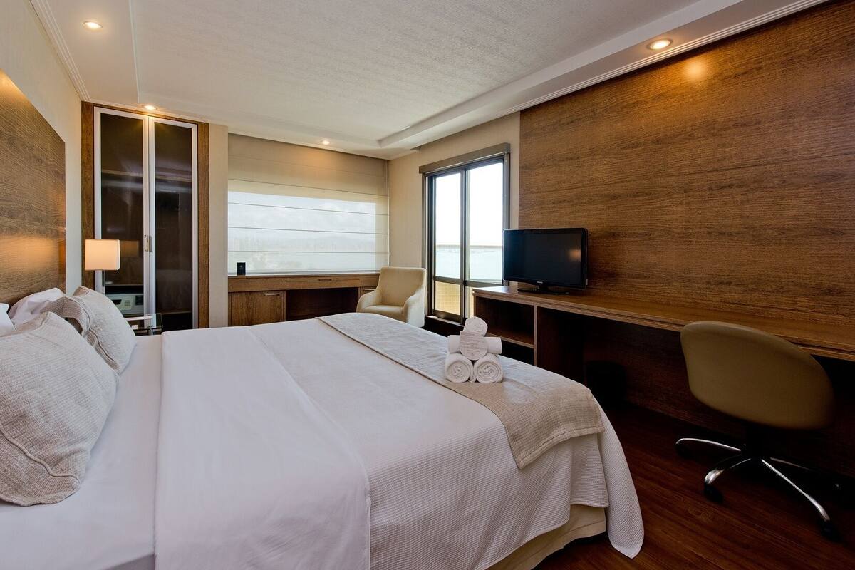 Standard Double Room, Balcony, Partial Sea View | Minibar, in-room safe, desk, blackout drapes