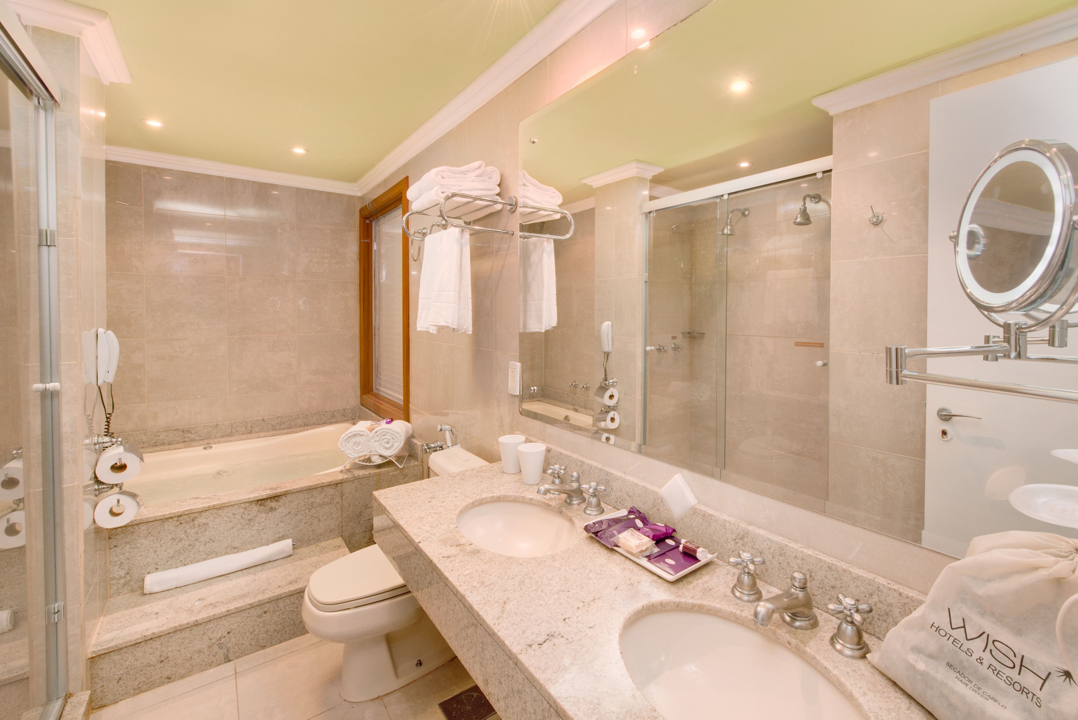 junior suite | bathroom | bathtub, jetted bath, free toiletries, hair dryer