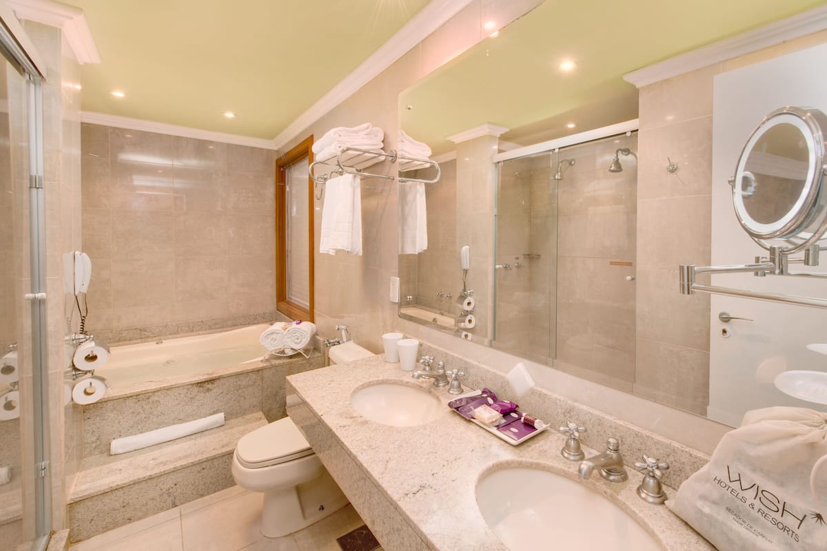 junior suite | bathroom | bathtub, jetted bath, free toiletries, hair dryer