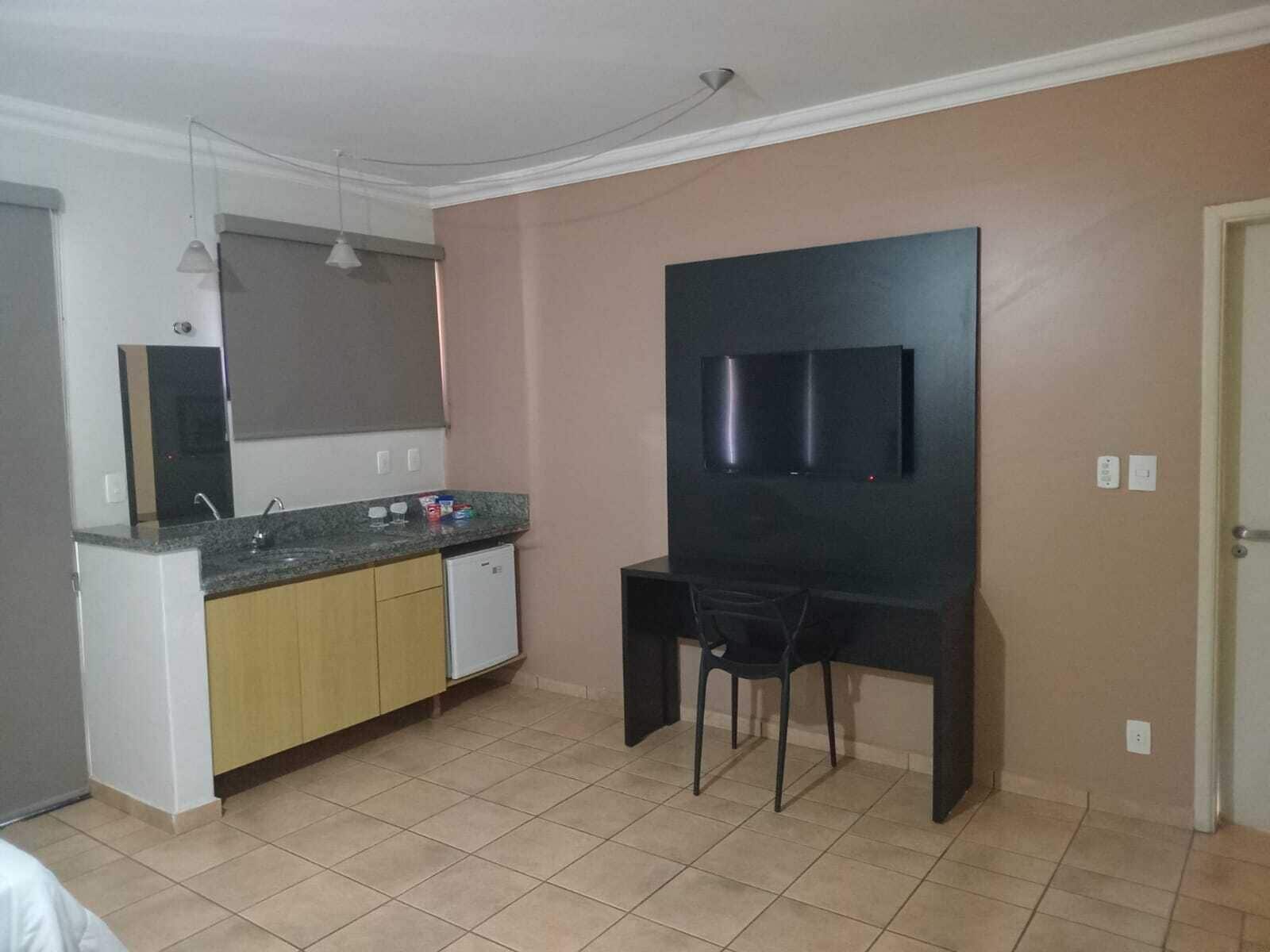 deluxe triple room | living area | 42-inch tv with cable channels