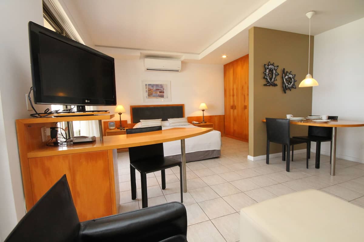 Suite, Partial Sea View | Living area | 20-inch TV with cable channels