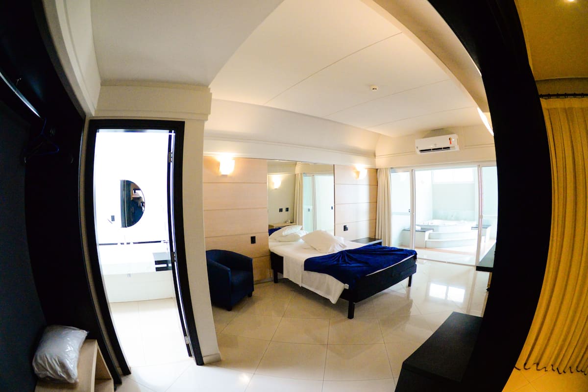 junior suite, 1 king bed | living room | 39-inch lcd tv with cable channels, tv