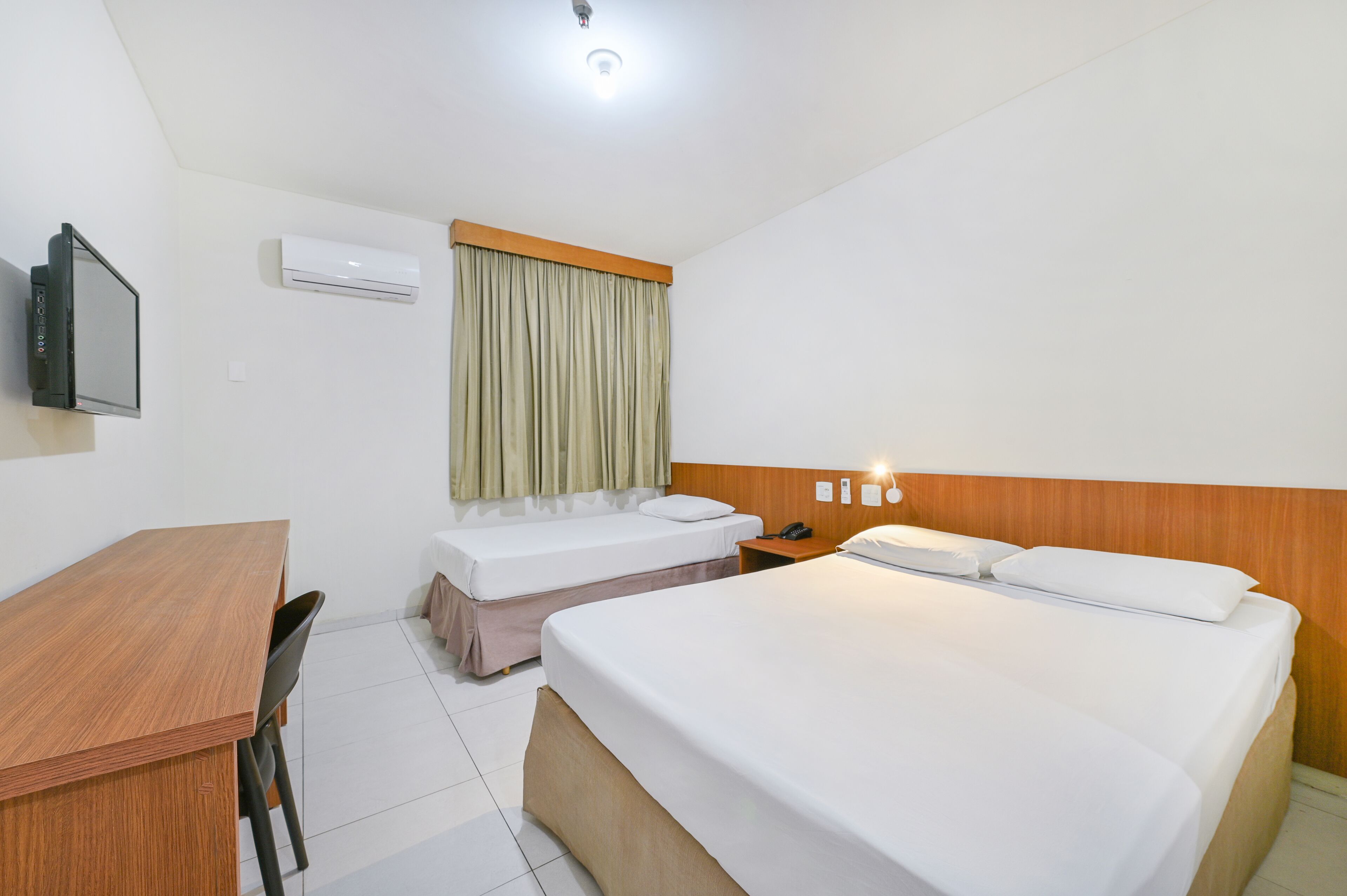 Standard Double or Twin Room | Minibar, in-room safe, desk, blackout drapes