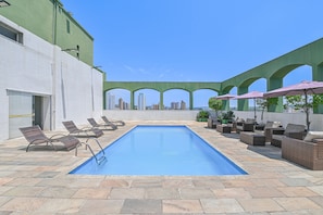 Outdoor pool, pool umbrellas, sun loungers