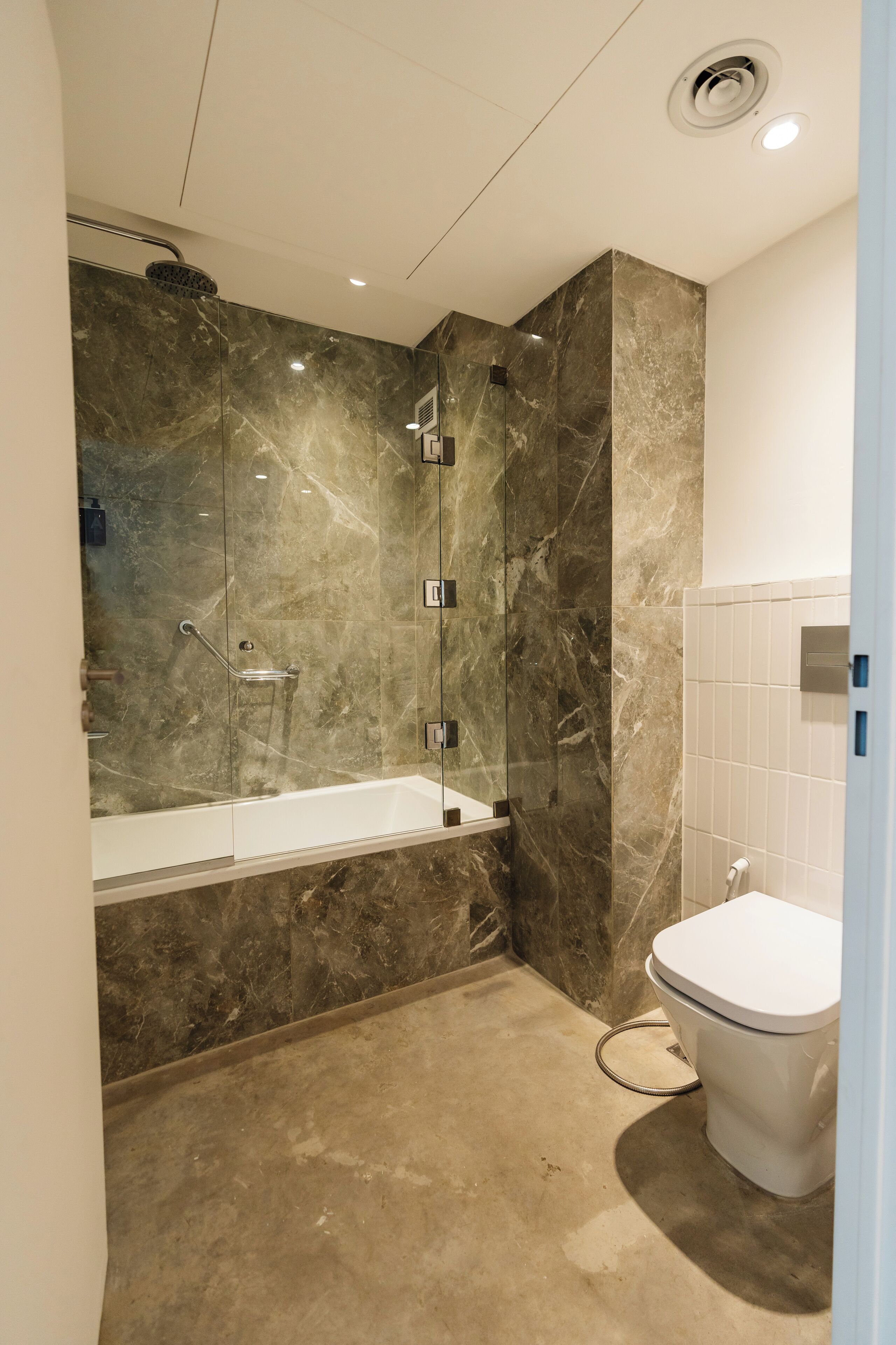 rainfall showerhead, designer toiletries, hair dryer, towels