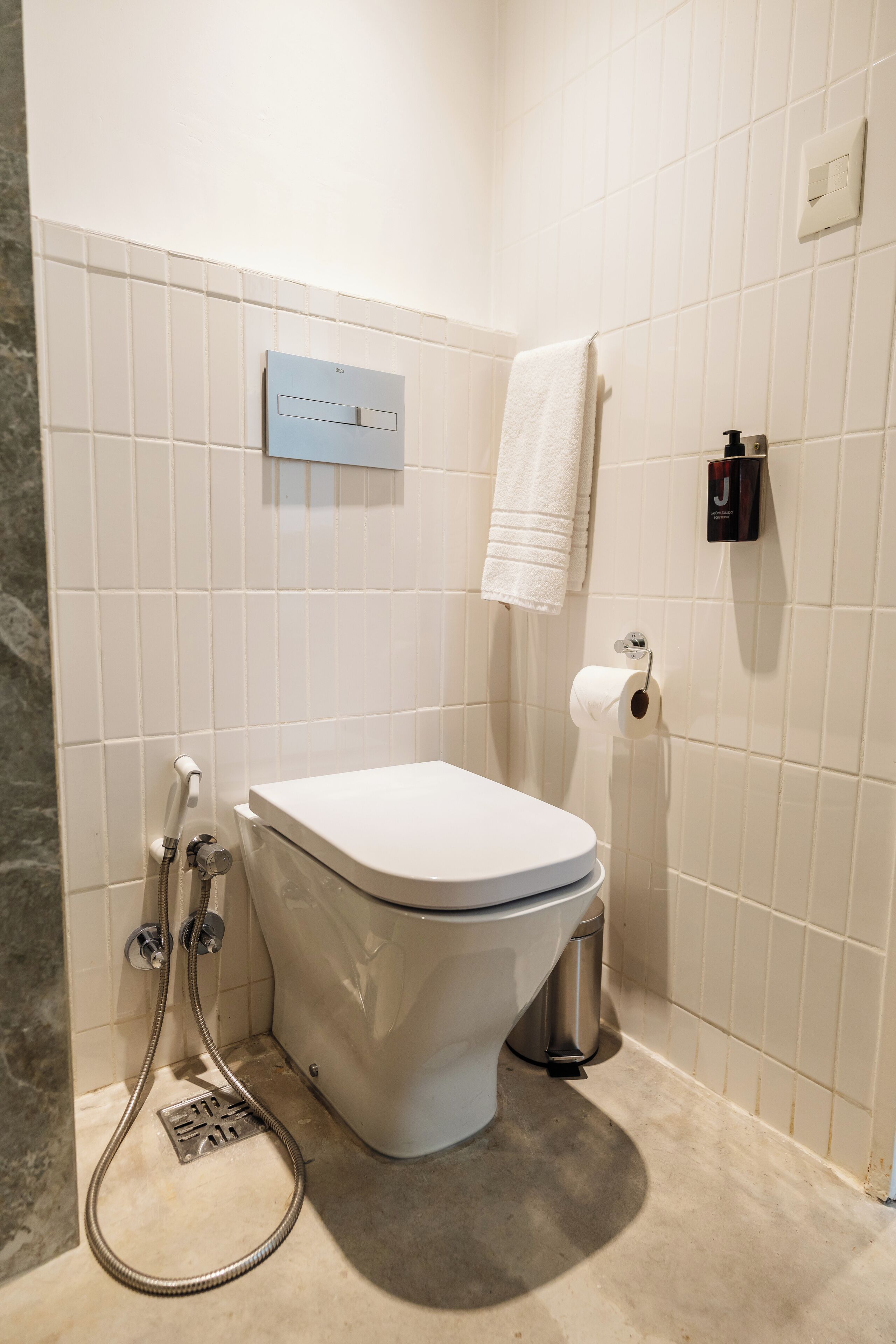 rainfall showerhead, designer toiletries, hair dryer, towels