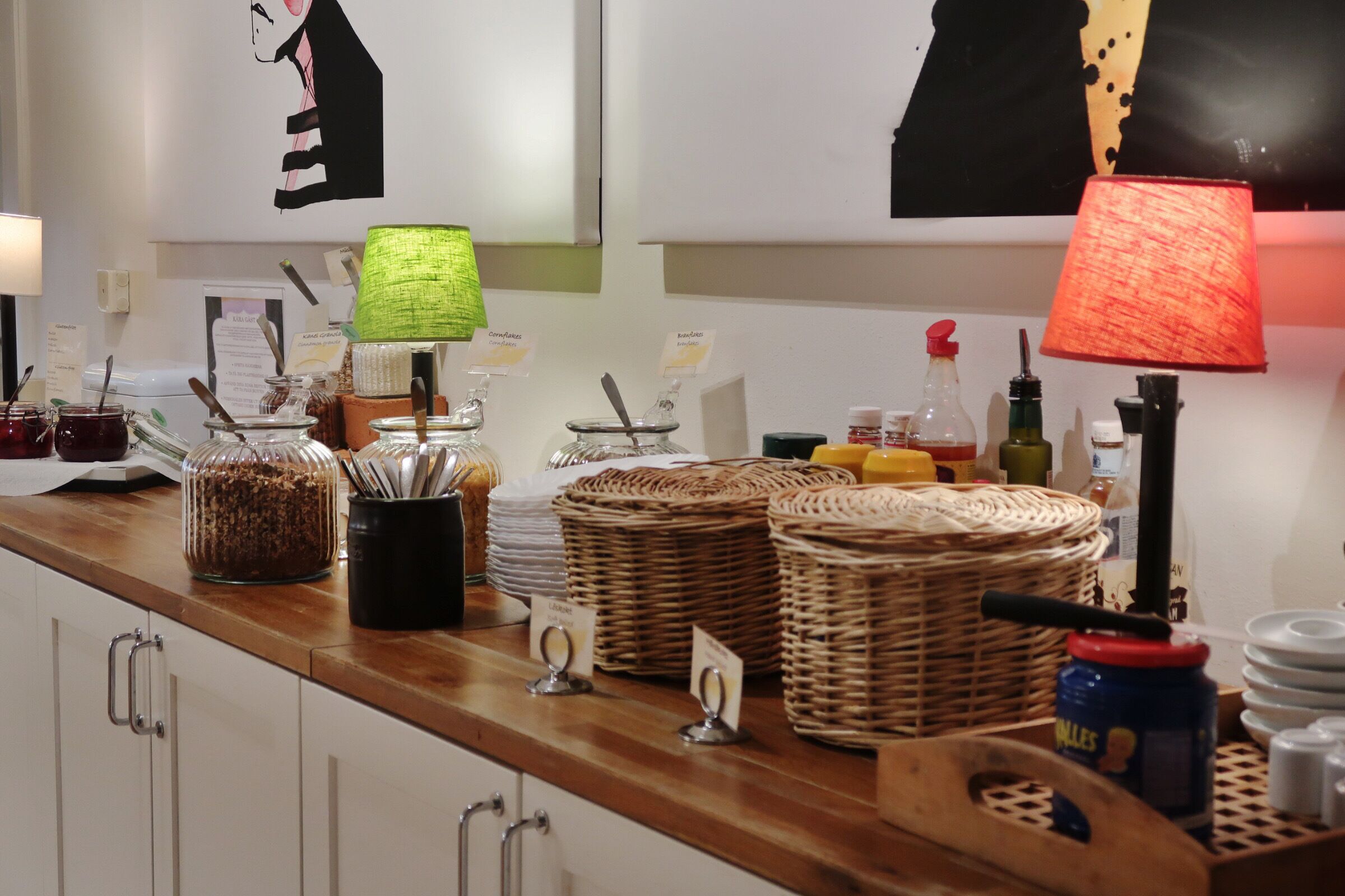 A buffet setup with various food items and condiments.
