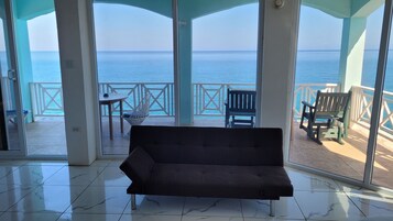 New Penthouse Suite: Room 19 | Living area | 27-inch flat-screen TV with cable channels