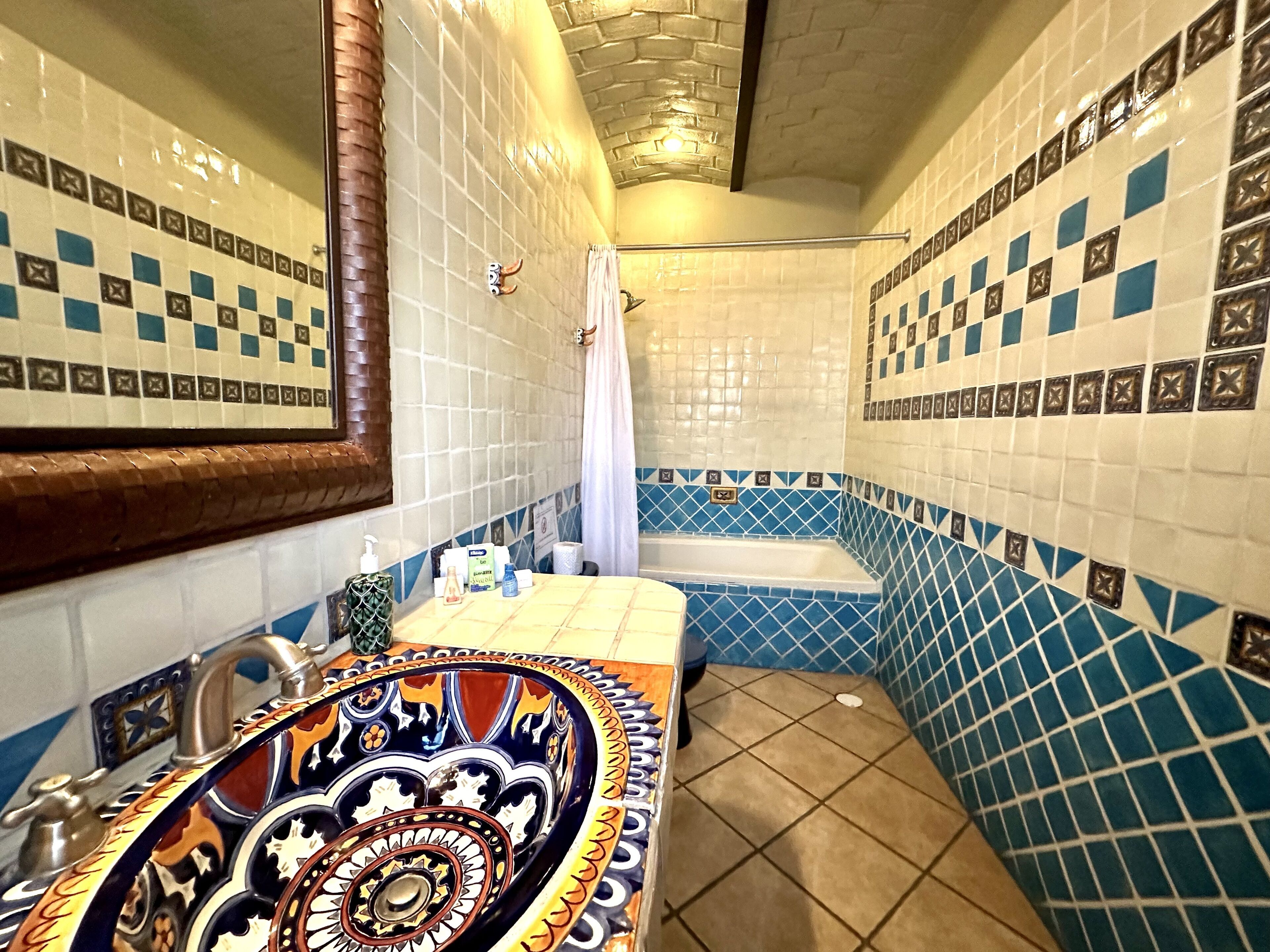 deluxe room | bathroom | rainfall showerhead, free toiletries, hair dryer, towels