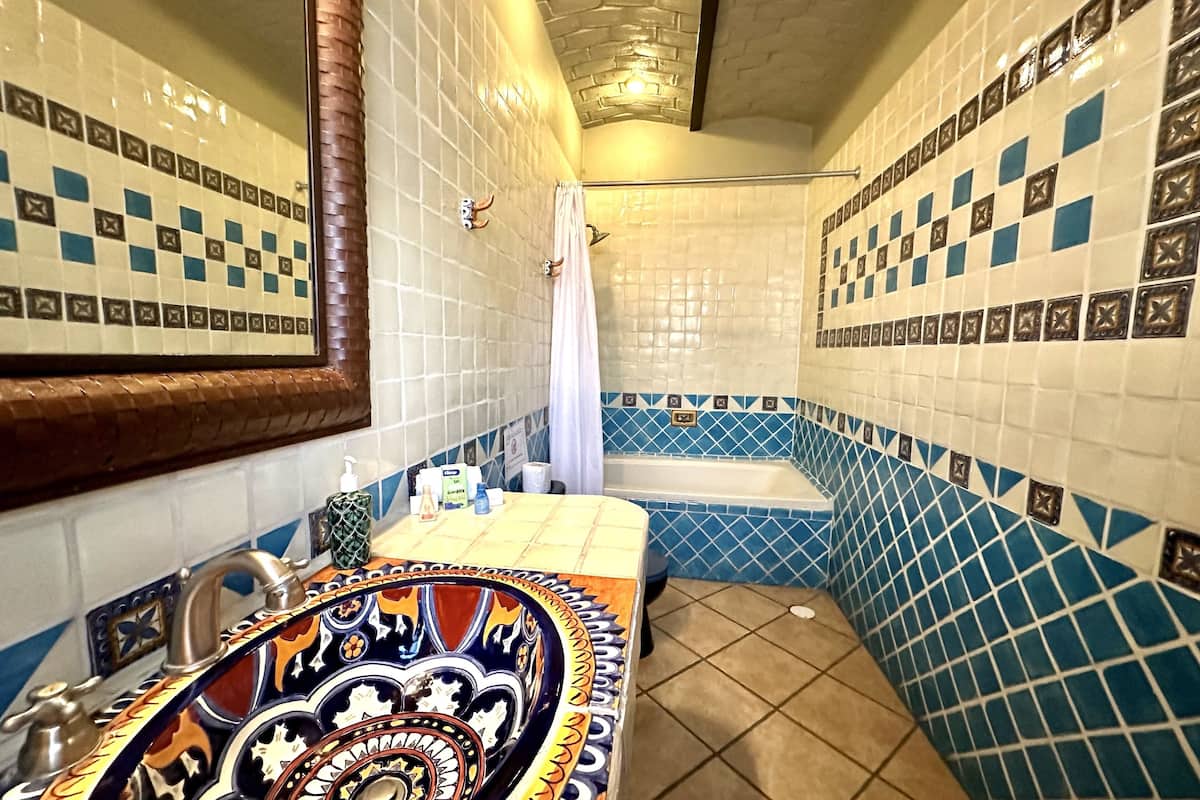 deluxe room | bathroom | rainfall showerhead, free toiletries, hair dryer, towels