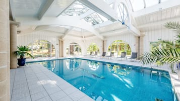 Indoor pool, seasonal outdoor pool, open 10 AM to 9 PM, pool loungers