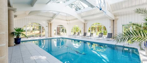 Indoor pool, seasonal outdoor pool, open 10 AM to 9 PM, pool loungers