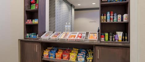 A snack bar with various chips and beverages.