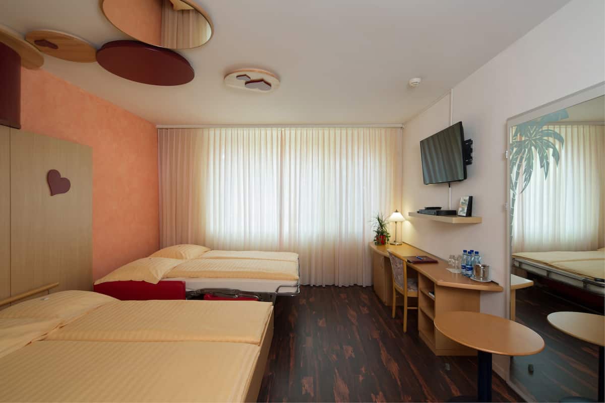 Family Room | Premium bedding, in-room safe, desk, iron/ironing board (on request)