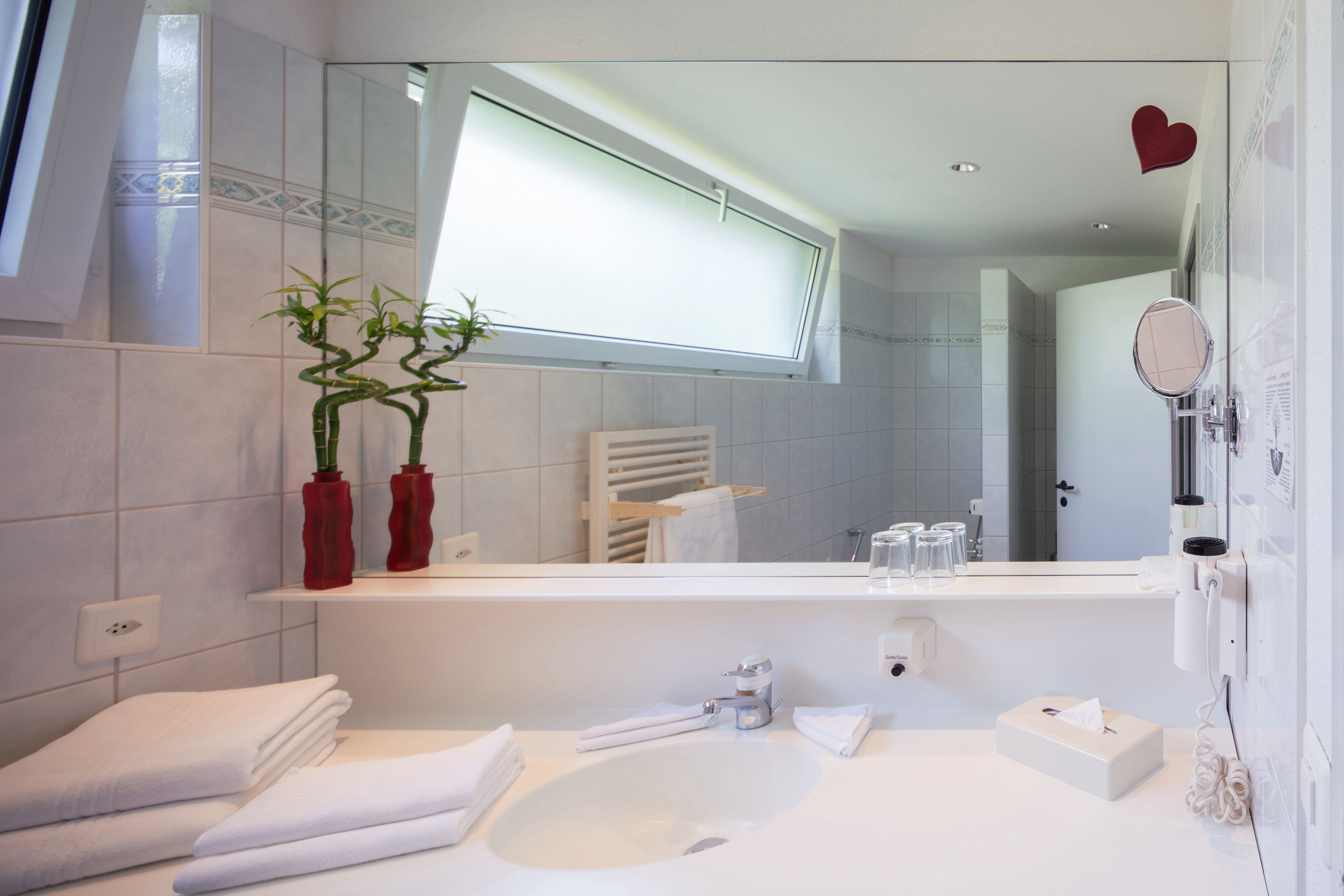 family room | bathroom | combined shower/bathtub, hair dryer, towels