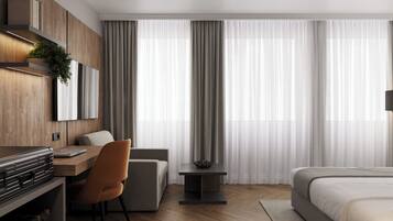 Deluxe Room | Minibar, desk, laptop workspace, blackout drapes