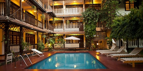 Outdoor pool, pool loungers. Protea Hotel by Marriott Dar es Salaam Courtyard