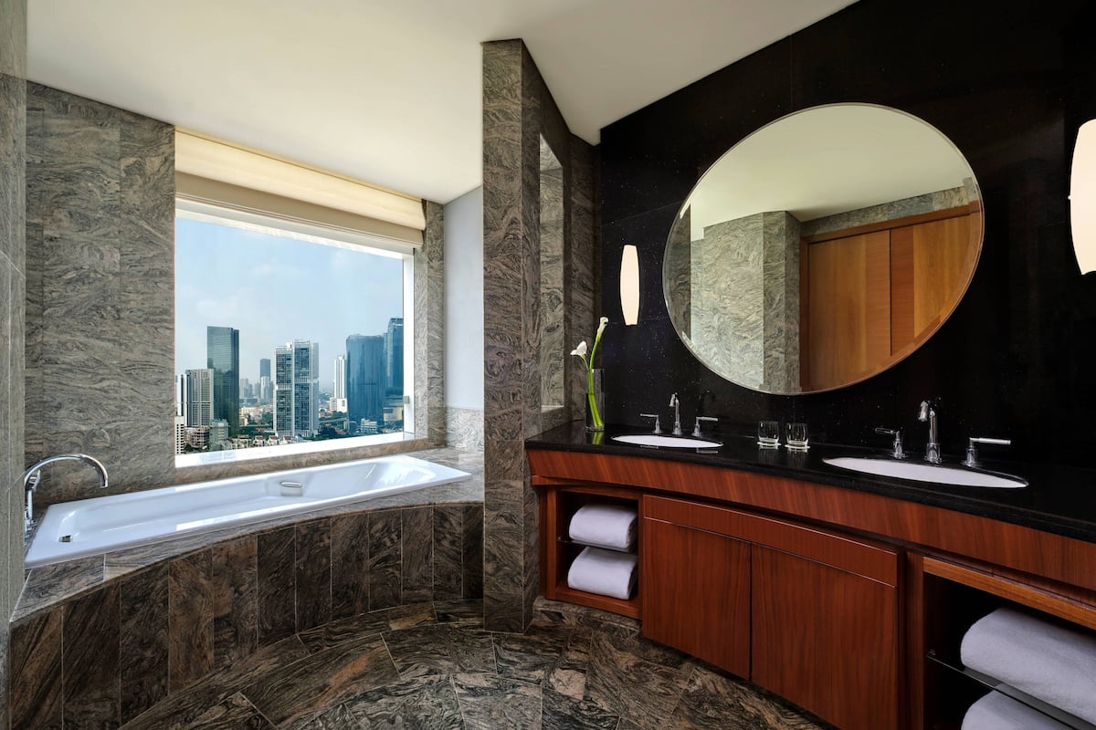 club room, 1 king bed | bathroom | separate bathtub and shower, designer toiletries, hair dryer, bathrobes