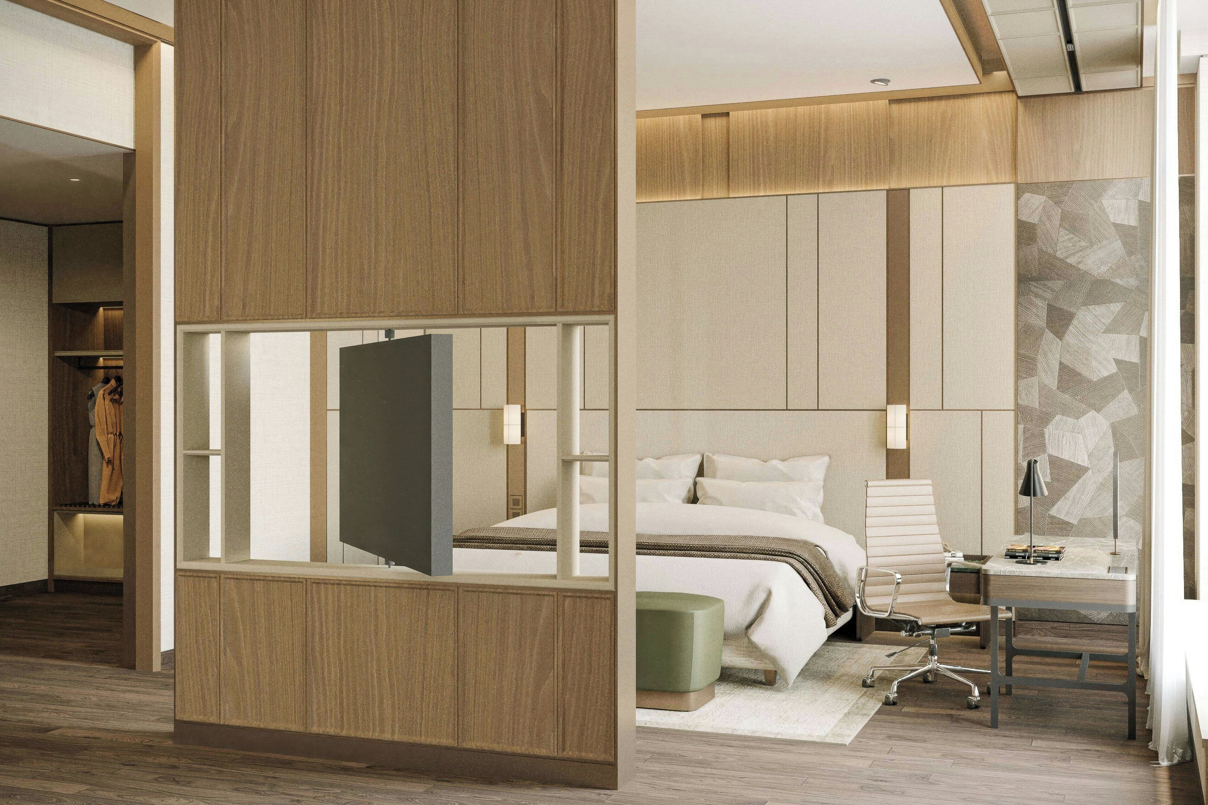 أغطية فراش متميزة وميني بار وخزنة داخل الغرفة ومكتب