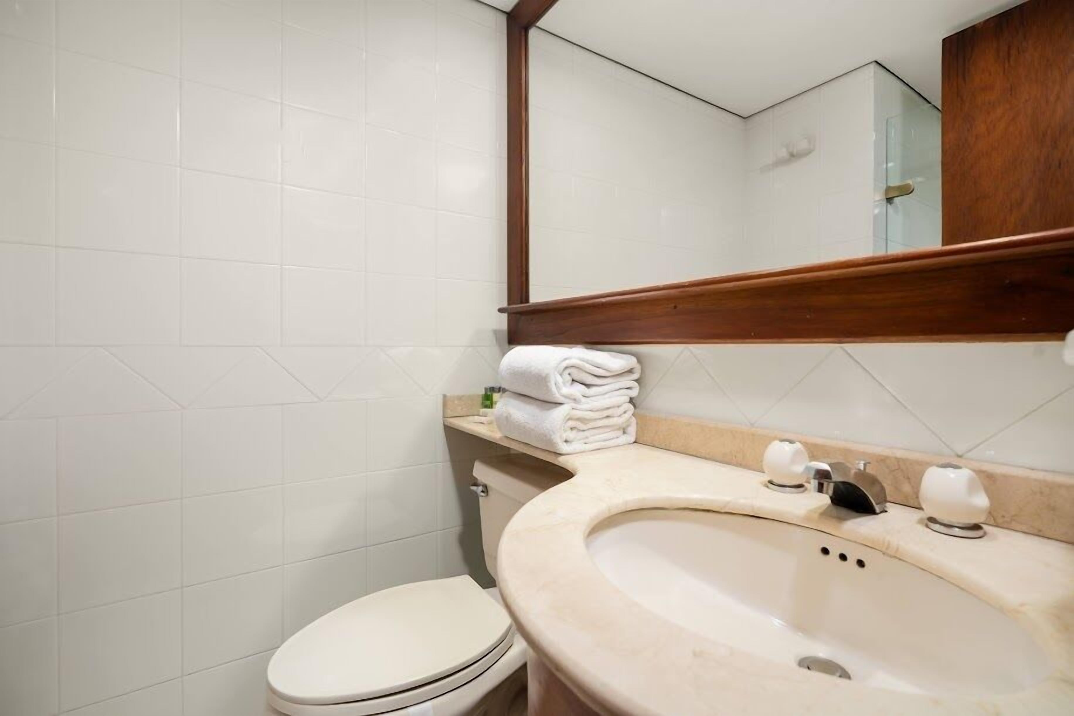 standard suite | bathroom | shower, rainfall showerhead, free toiletries, hair dryer