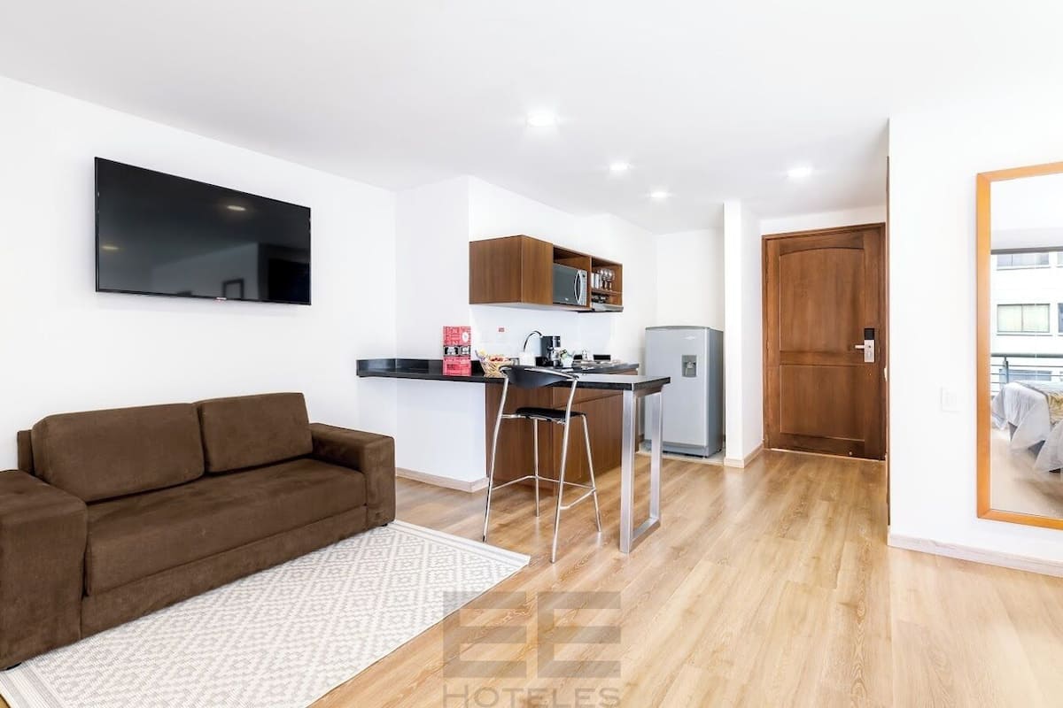 suite, 2 double beds | living area | 32-inch lcd tv with satellite channels, tv