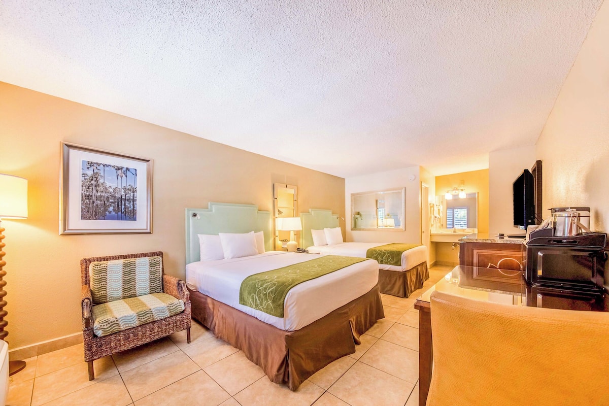 deluxe room, 2 queen beds | premium bedding, desk, iron/ironing board, free cots/infant beds