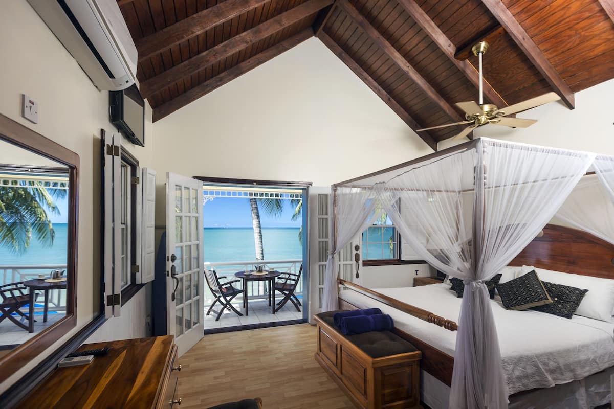 honeymoon villa, balcony, sea view | in-room safe, desk, iron/ironing board, free cots/infant beds