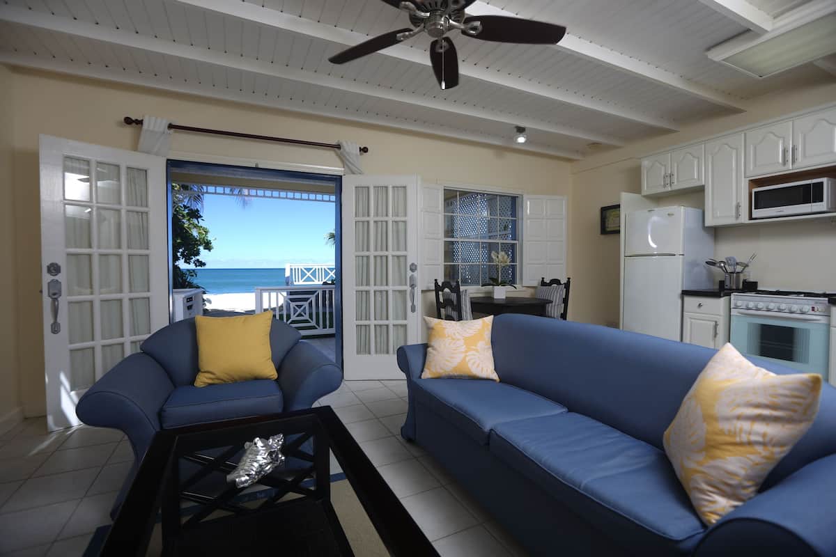 standard suite, 1 bedroom, kitchen, sea view | living area | flat-screen tv, dvd player