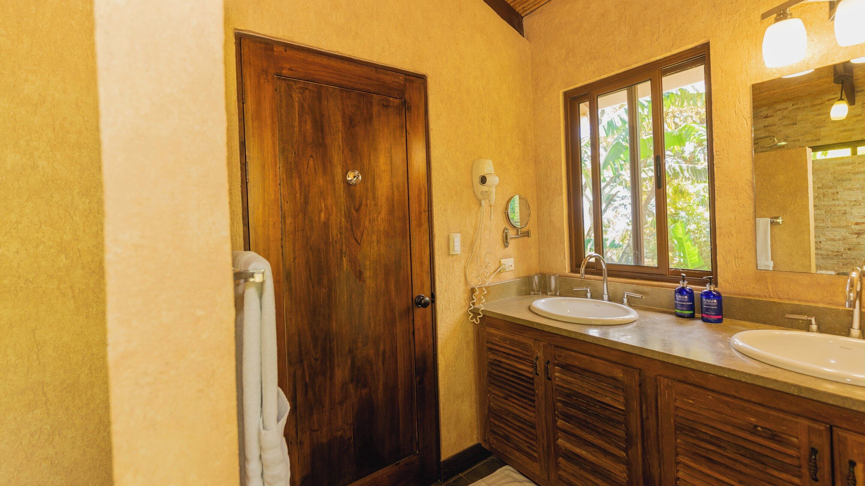 family villa | bathroom | shower, rainfall showerhead, designer toiletries, hair dryer