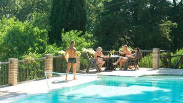 Seasonal outdoor pool, pool loungers