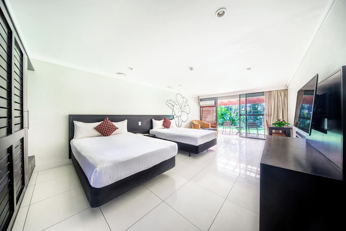 deluxe double room, 2 double beds | in-room safe, individually decorated, individually furnished, desk