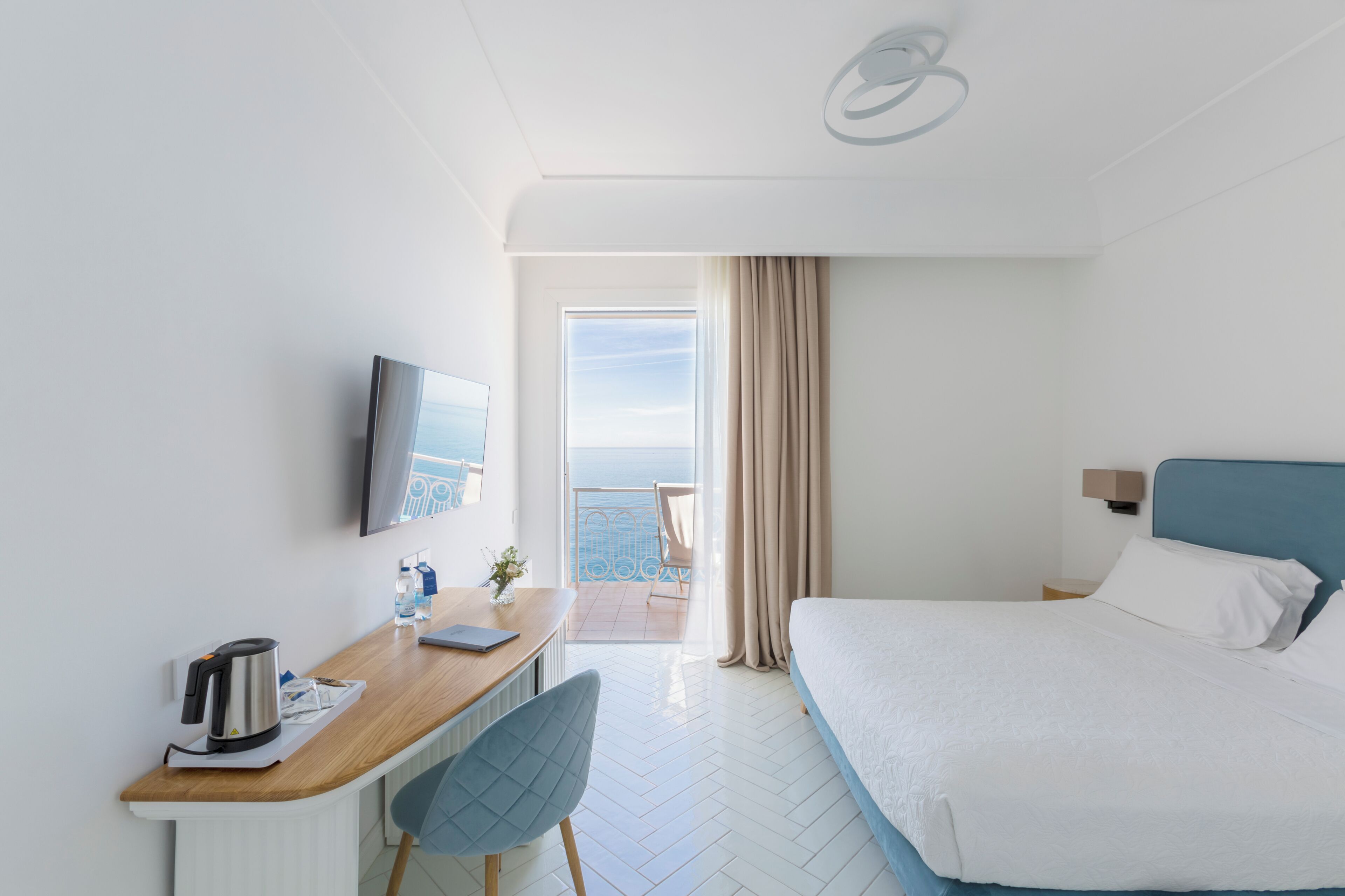Deluxe Room, Sea View | Minibar, in-room safe, desk, free WiFi