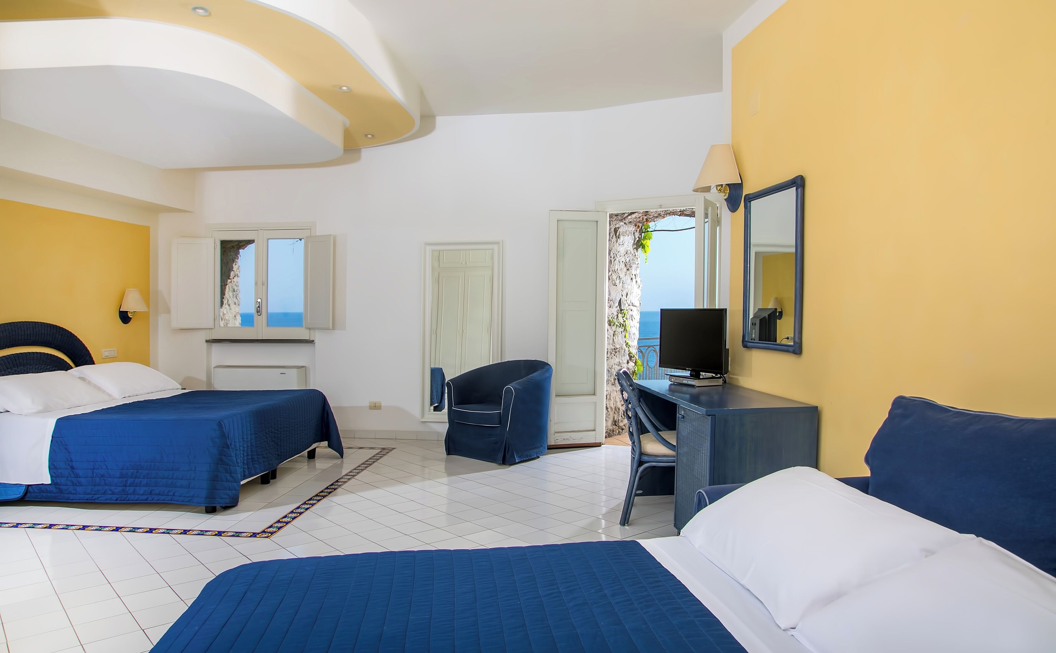 Classic Quadruple Room, Sea View | Minibar, in-room safe, desk, free WiFi