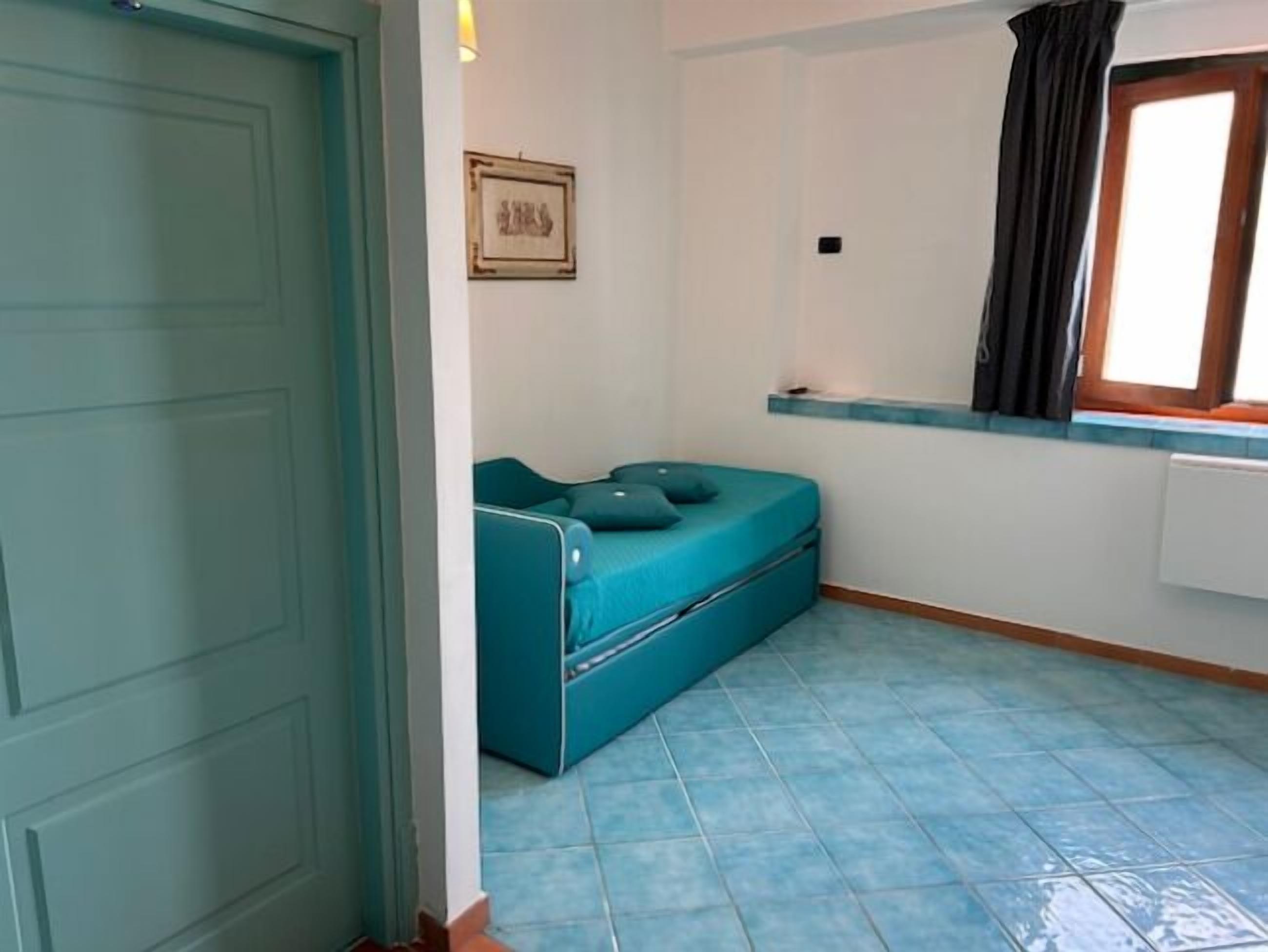 family room | 1 bedroom, select comfort beds, minibar, in-room safe