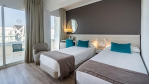 A hotel room with two beds, a large window with curtains, a chair, and a view of the outside. - Hotel THB Niagara - Adults Only (Palma de Mallorca)