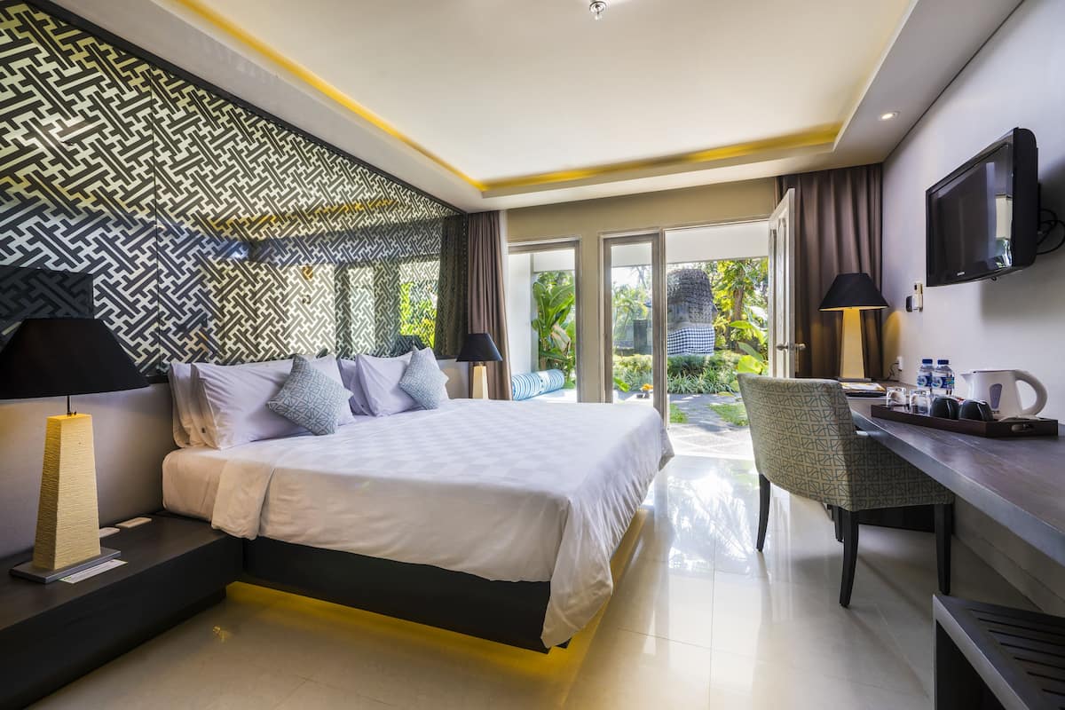 Luxe beddengoed, een minibar, een kluis op de kamer, een bureau
