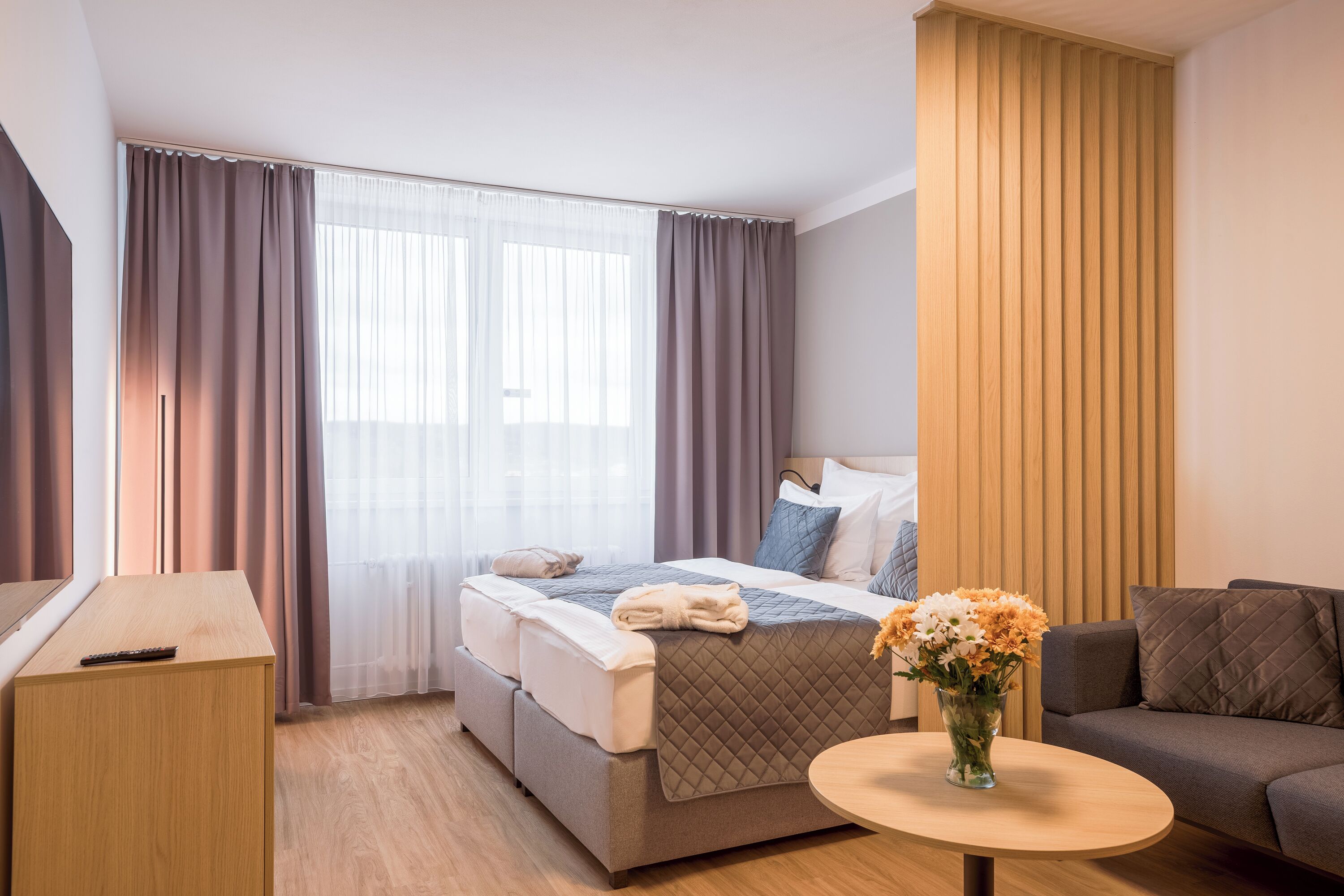 deluxe apartment | living area | 72-cm lcd tv with satellite channels, tv