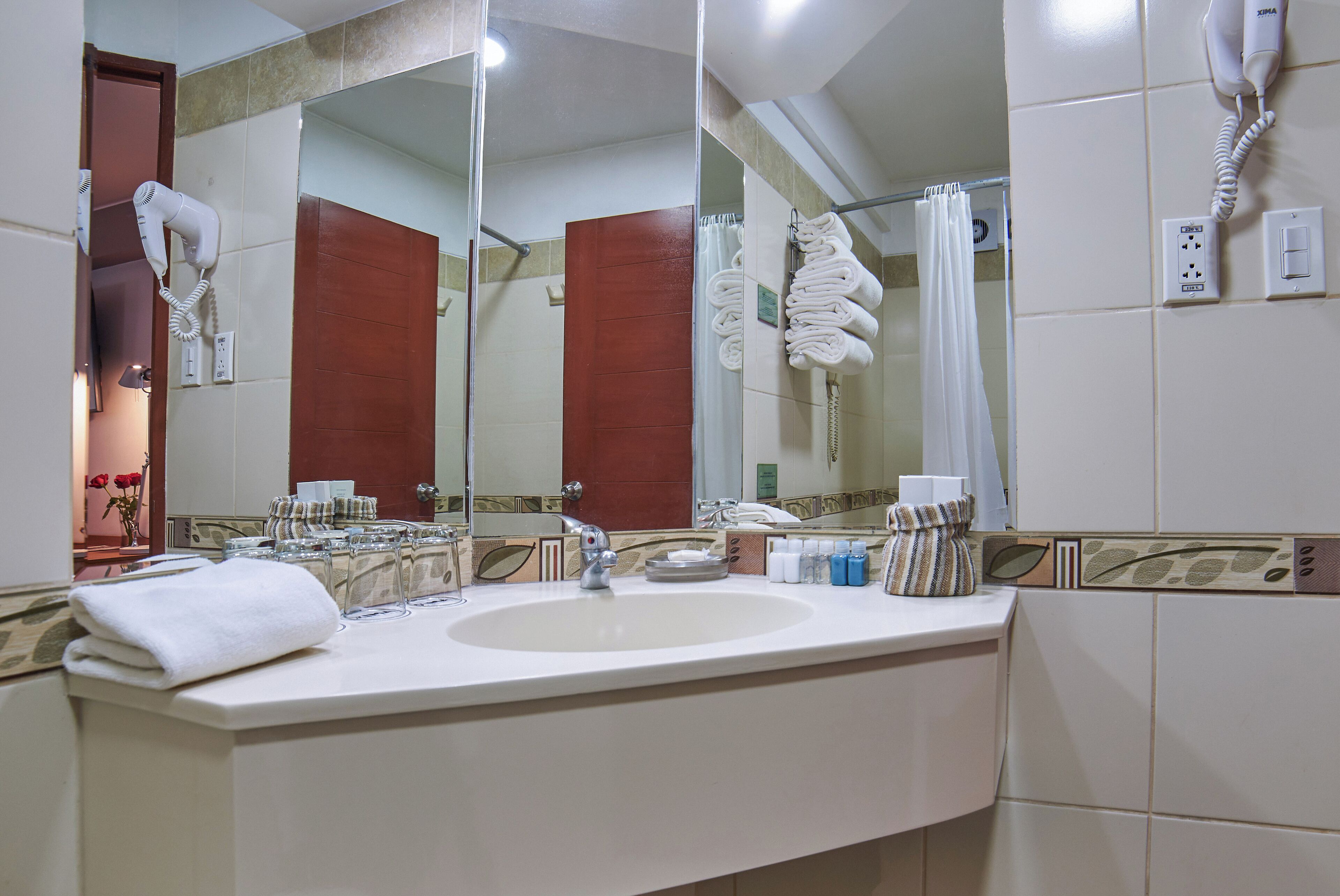 Shower, rainfall showerhead, hair dryer, towels