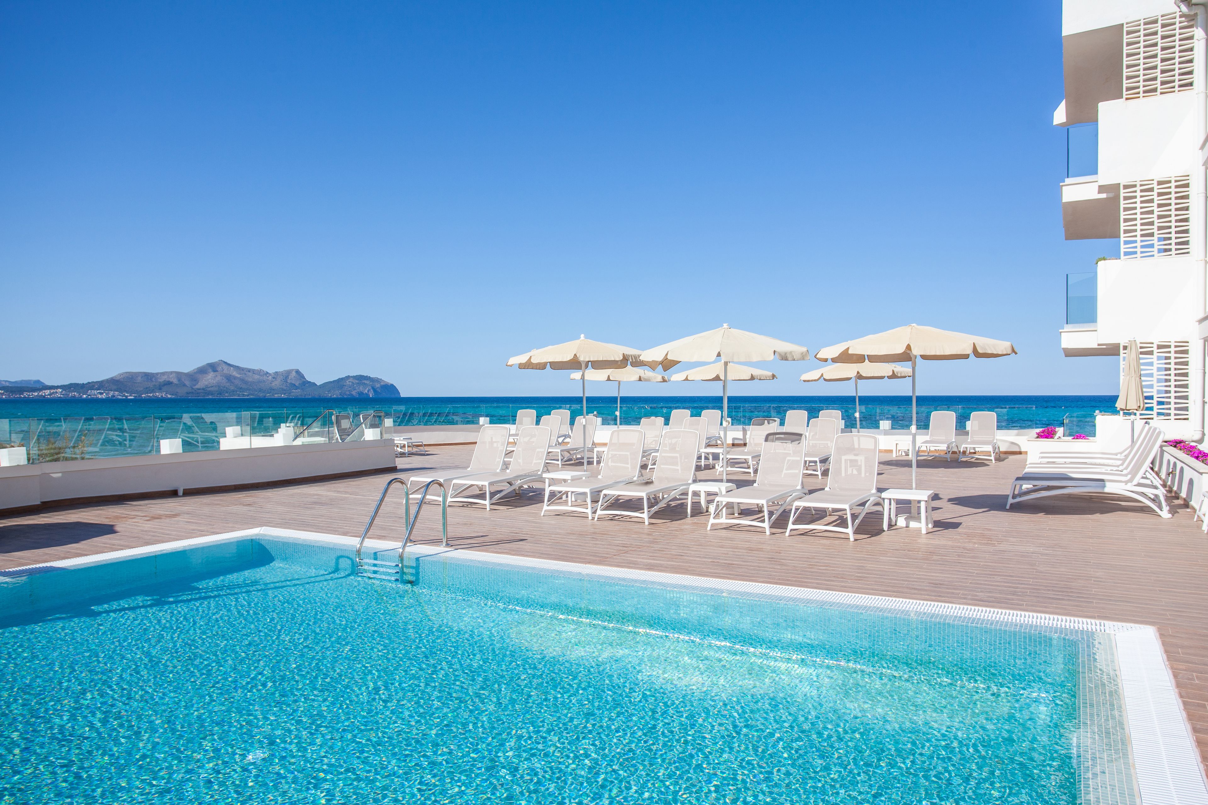 outdoor pool, pool umbrellas, pool loungers