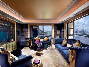 A luxurious living room with a city view, a large sofa, a coffee table, and elegant decor. - Sofitel Macau At Ponte 16 (Macau)