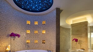 A modern bathroom with a circular hot tub, a starry ceiling, and a spa area. - Sofitel Macau At Ponte 16 (Macau)