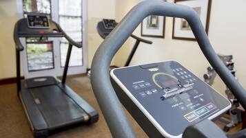 A gym with treadmills and exercise equipment.