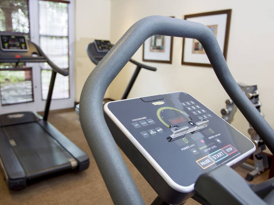 A gym with treadmills and exercise equipment.