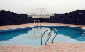 Seasonal outdoor pool, pool cabanas (surcharge), pool umbrellas