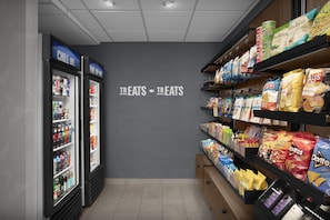 A grocery store aisle with snacks and beverages. - Hampton Inn & Suites Phoenix Glendale-Westgate (Glendale)